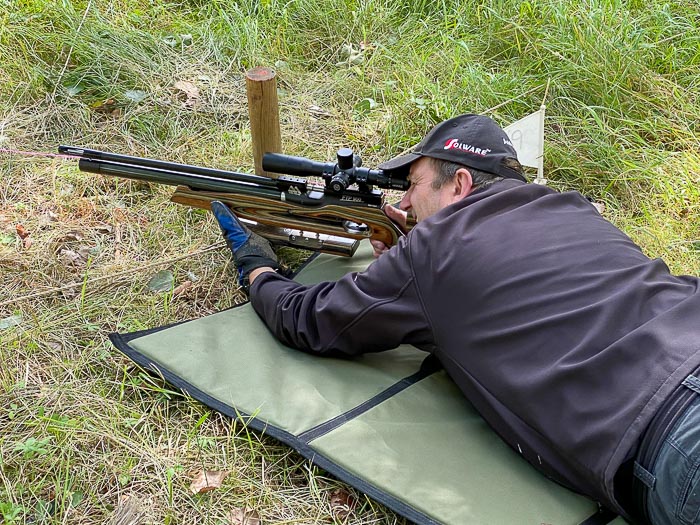 Prone shooter taking a shot in HFT